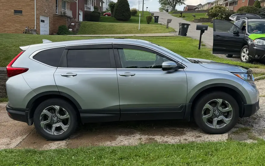 The CR-V washed and dried, parked on the driveway